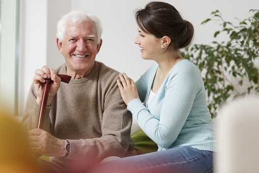 Woman caring for father with Dementia